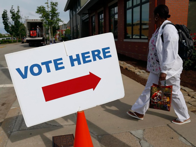 A resident walks near a polling place in East Liberty on May 21, 2019. Voting has changed dramatically in the wake of the coronavirus. (Photo by Ryan Loew/PublicSource)