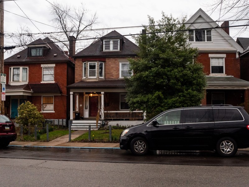 The house owned by Maddie Gioffre and Shaquille Charles, center, is subject to tax bills that are roughly double those of the house on the left, and triple the property on the right. (Photo by Lindsay Dill/PublicSource)