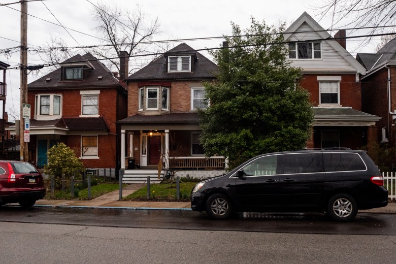 The house owned by Maddie Gioffre and Shaquille Charles, center, is subject to tax bills that are roughly double those of the house on the left, and triple the property on the right. (Photo by Lindsay Dill/PublicSource)