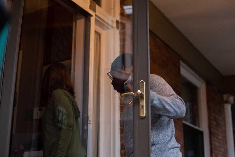 Maddie Gioffre and Shaquille Charles enter their Wilkinsburg home on April 5, 2022. ”We feel trapped, to be honest,” Charles said. (Photo by Lindsay Dill/PublicSource)