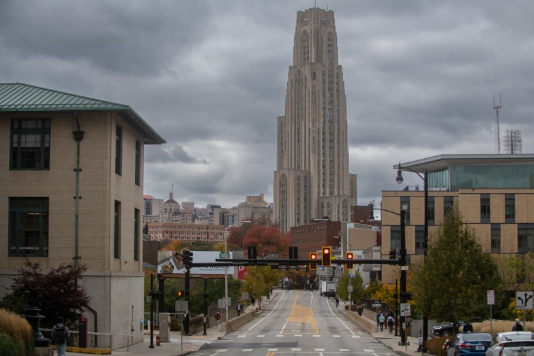 The University of Pittsburgh’s Cathedral of Learning rises beyond Forbes Ave., Tuesday, Oct. 18, 2022, in Oakland. (Photo by Stephanie Strasburg/PublicSource)