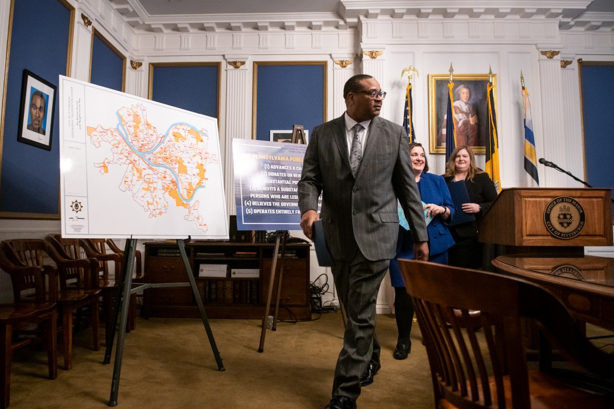 Pittsburgh Mayor Ed Gainey, Krysia M. Kubiak, chief legal officer and city solicitor, and Jen Gula, director of finance and treasurer for the city, walk past a map of the city’s tax-exempt property after announcing a review of those parcels on Jan. 24, at the mayor’s City-County Building offices in Downtown.