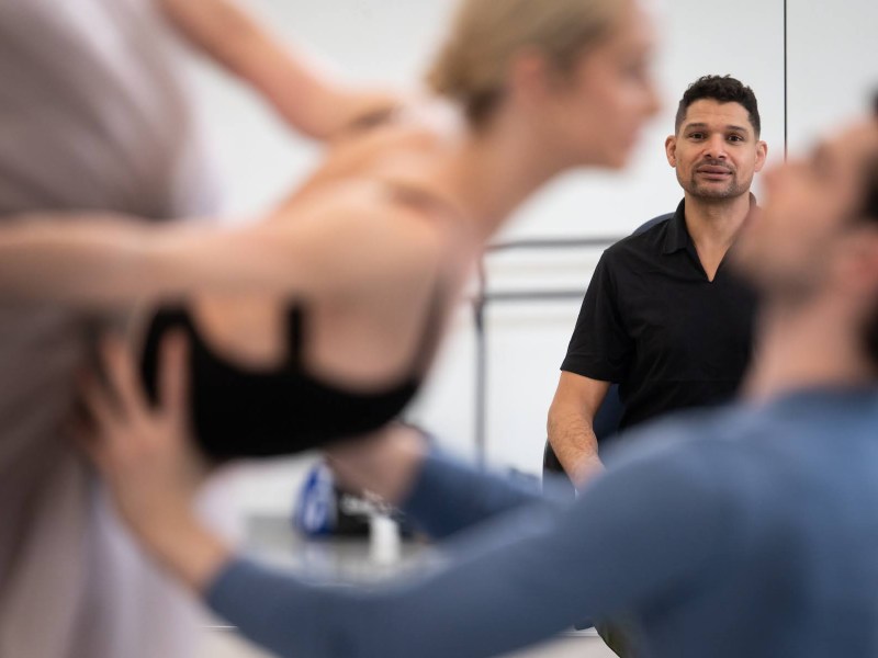 Adam McKinney, the new artistic director for the Pittsburgh Ballet Theatre, leads a rehearsal for “Sleeping Beauty” with PBT artists Tommie Lin O’Hanlon, left, and Colin McCaslin, right, on Monday, April 24, 2023, in the Strip District. (Photo by Stephanie Strasburg/PublicSource)