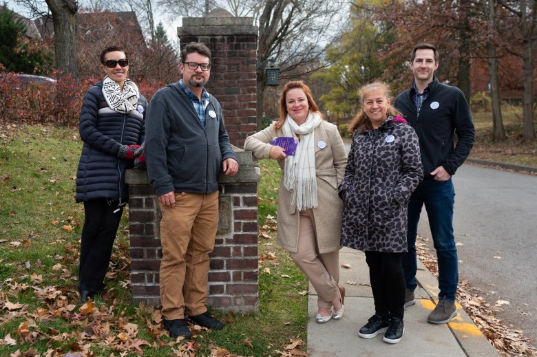 Some of the Chatham University faculty members on the organizing committee to unionize stand for a portrait along Fifth Avenue by the school, Monday, Nov. 20, 2023, in Squirrel Hill.