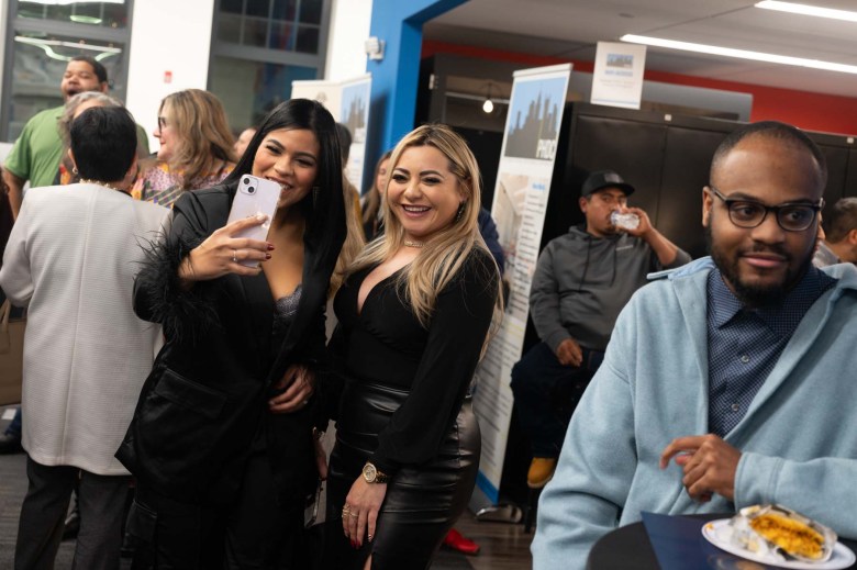 A group of people posing for a photo at an event.