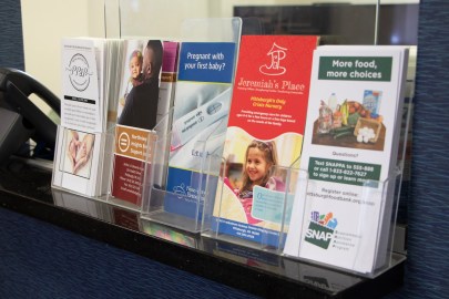 Informational pamphlets displayed at the MAYA Organization office in Swissvale on July 12, 2023. MAYA's mission is to "empower BIPOC and marginalized birthing people and birthworkers, and to create positive change in the systems that impact them." (Photo by Alexis Wary/PublicSource)