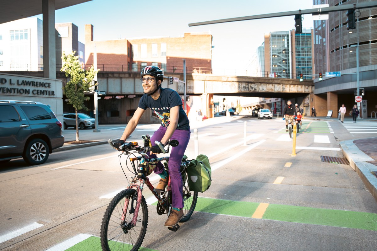 Armin Samii cycles on the Penn Avenue bike lane.