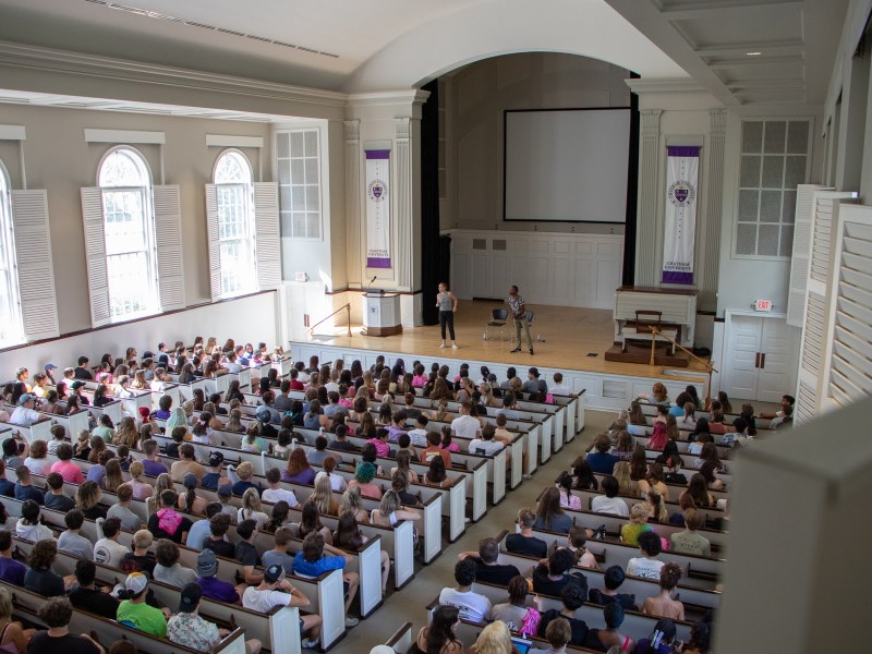 Incoming freshmen at Chatham University gather inside the Campbell Memorial Chapel on Sunday, Aug. 27, 2023 for a mandatory, hour-long presentation on consent and sexual violence prevention. (Photo by Alexis Wary/PublicSource)