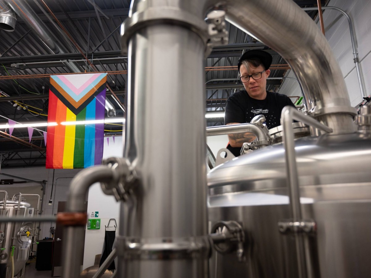 Necromancer head brewer Lauren Hughes, of Greenfield, at work in the brewery in Ross. (Photo by Stephanie Strasburg/PublicSource)