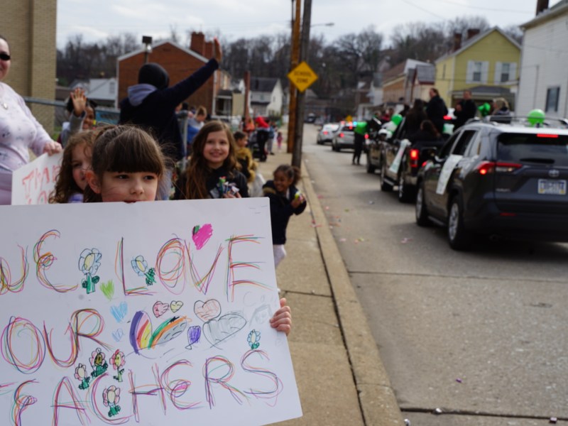 Students and their parents lined the street outside the Sto-Rox junior and senior high school to show support for their school district during a parade on April 4, 2022. (Photo by Oliver Morrison/PublicSource)