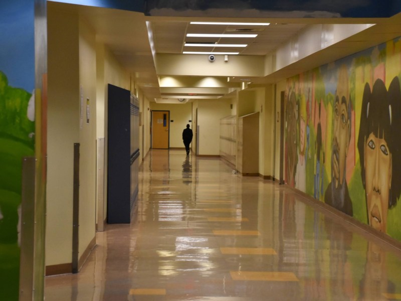 A student walks down a hallway at UPrep Milliones on Tuesday, February 21, 2023. (Photo by Amaya Lobato-Rivas/PublicSource)