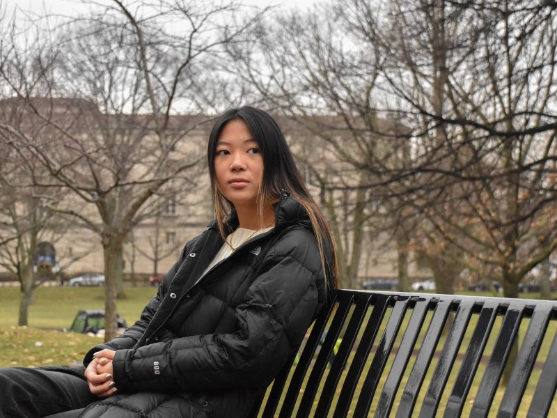 Senior Jenna Berman sits on a bench on Pitt's campus.