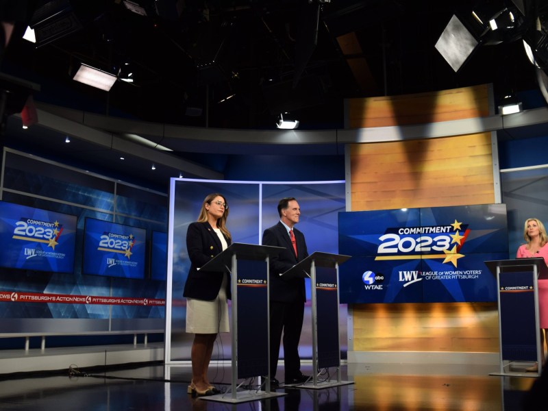 Sara Innamorato and Joe Rockey on stage at a televised debate