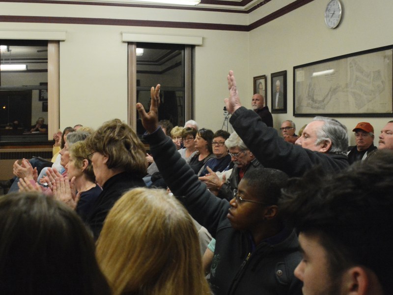 Nearly 50 Munhall residents crammed into the borough's council meeting Tuesday night to hear their elected officials debate the sale of seven acres of land to a private company. Council tabled the bill of sale unanimously. (Photo by Stephen Caruso/PublicSource)