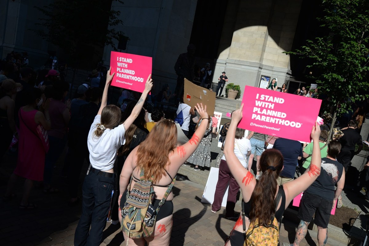 People gather in front of the City-County Building on June 24 to protest the U.S. Supreme Court's decision to overturn constitutional protection for abortions. (Photo by Clare Sheedy/PublicSource)