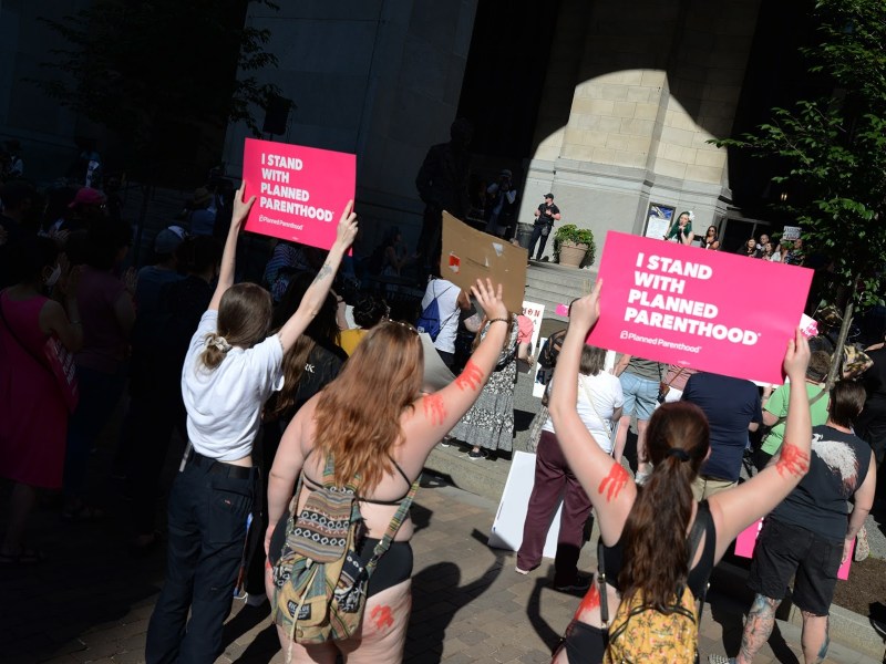 People gather in front of the City-County Building on June 24 to protest the U.S. Supreme Court's decision to overturn constitutional protection for abortions. (Photo by Clare Sheedy/PublicSource)