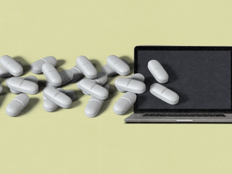 grayish white pills, coming from an open laptop screen, all on top of a faded yellow background.