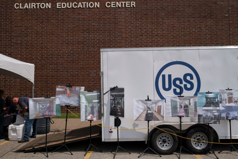 U.S Steel management displays photographs of steelworkers painting the Clairton Education Center at its reopening on Aug. 11, 2021. U.S. Steel also contributed $25,000 for the district to purchase laptops for students to use during the COVID-19 pandemic in 2020.