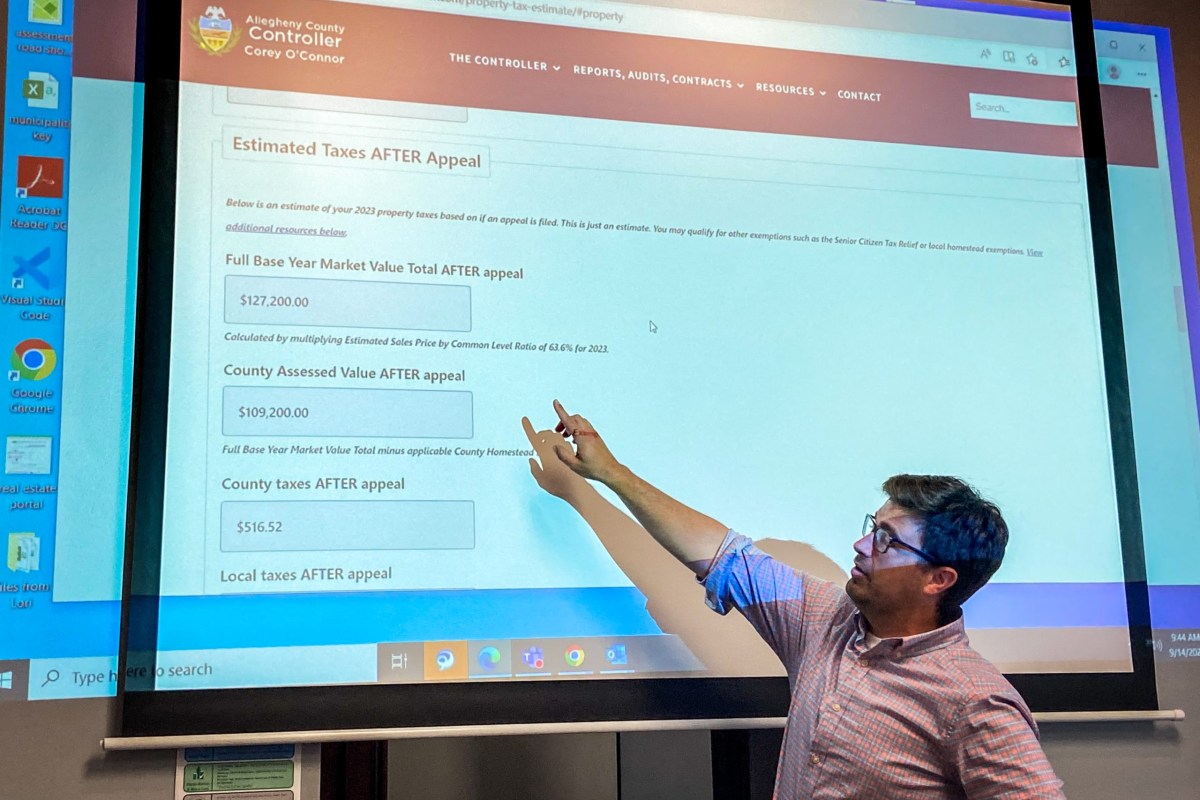 Allegheny County Controller Corey O’Connor demonstrates the Property Tax Estimate Worksheet that his office has made available to the public. (Photo by Rich Lord/PublicSource)