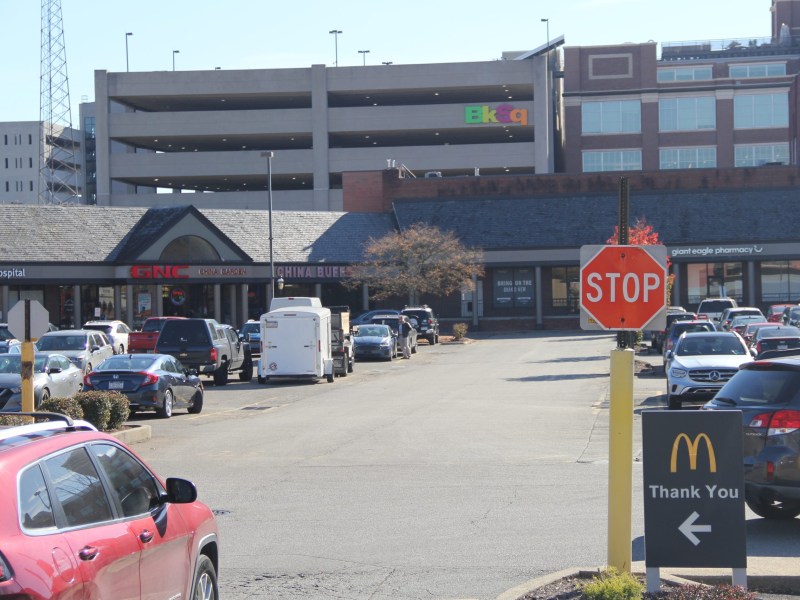 The Bakery Square logo in Pittsburgh's East End looks over a parking lot that Walnut Capital wants to redevelop. (Photo by Eric Jankiewicz/PublicSource)