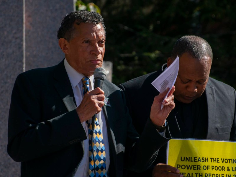 Tim Stevens speaks beside Dale Snyder at a rally