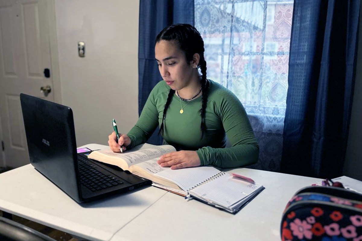 Mariana Velasquez Troncoso studying on her laptop.