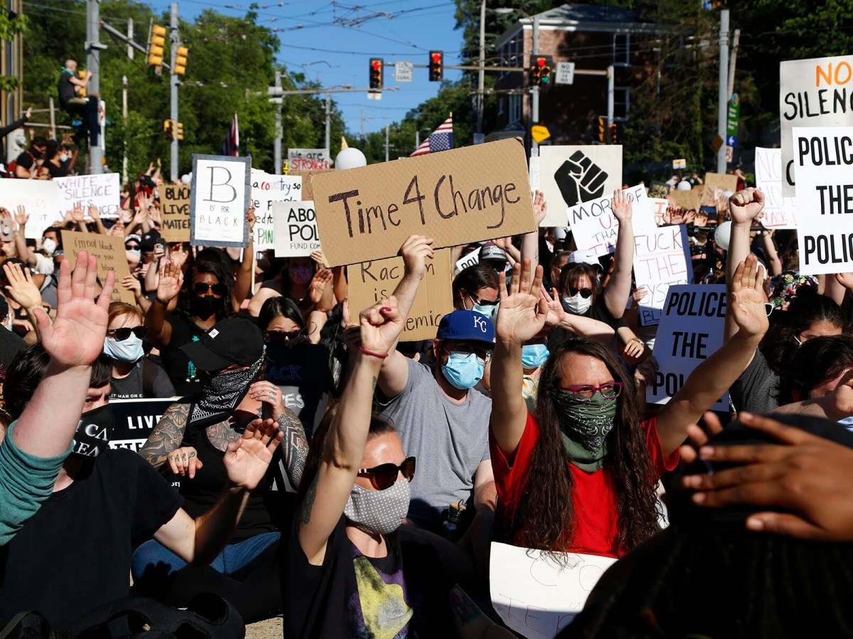 Protesters pause on Arlington Avenue en route to Downtown Pittsburgh in June 2020. (Photo by Ryan Loew/PublicSource)