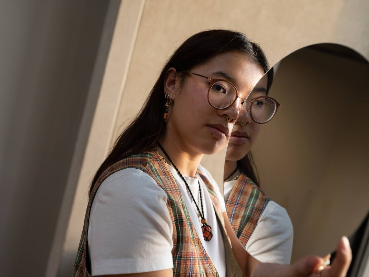 University of Pittsburgh student Mia Larkin poses for a portrait on campus on Wednesday, Sept. 21, 2022, in Oakland. (Photo by Stephanie Strasburg/PublicSource)