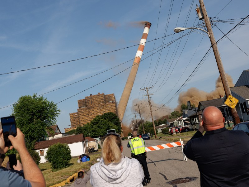 People gather to watch the demolition of the Cheswick Generating Station along Garfield Street in Springdale on June 2, 2023. (Photo by Quinn Glabicki/PublicSource)