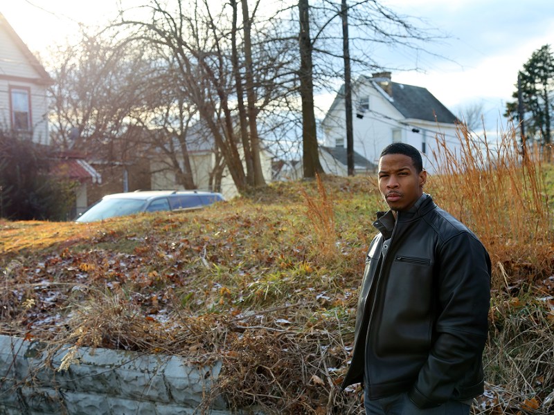 Terrell Thomas, pictured in front of the vacant lot that used to be his family home, lost his brother to gun violence in Beltzhoover in 2001. Sixteen years later, he’s troubled by persistent violence on the Hilltop. (Photo by Jeffrey Benzing/PublicSource)