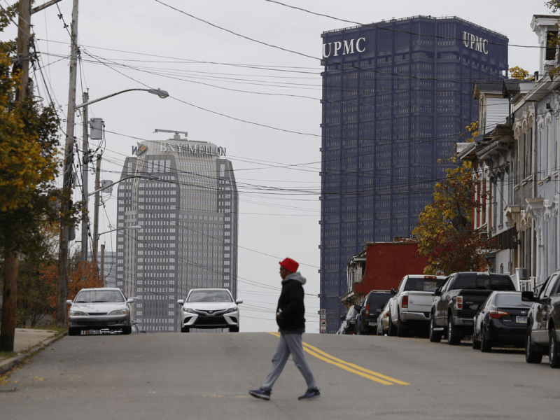 UPMC's logo atop the U.S. Steel Tower, Downtown, as seen from Webster Avenue in the Hill District. (Photo by Ryan Loew/PublicSource)