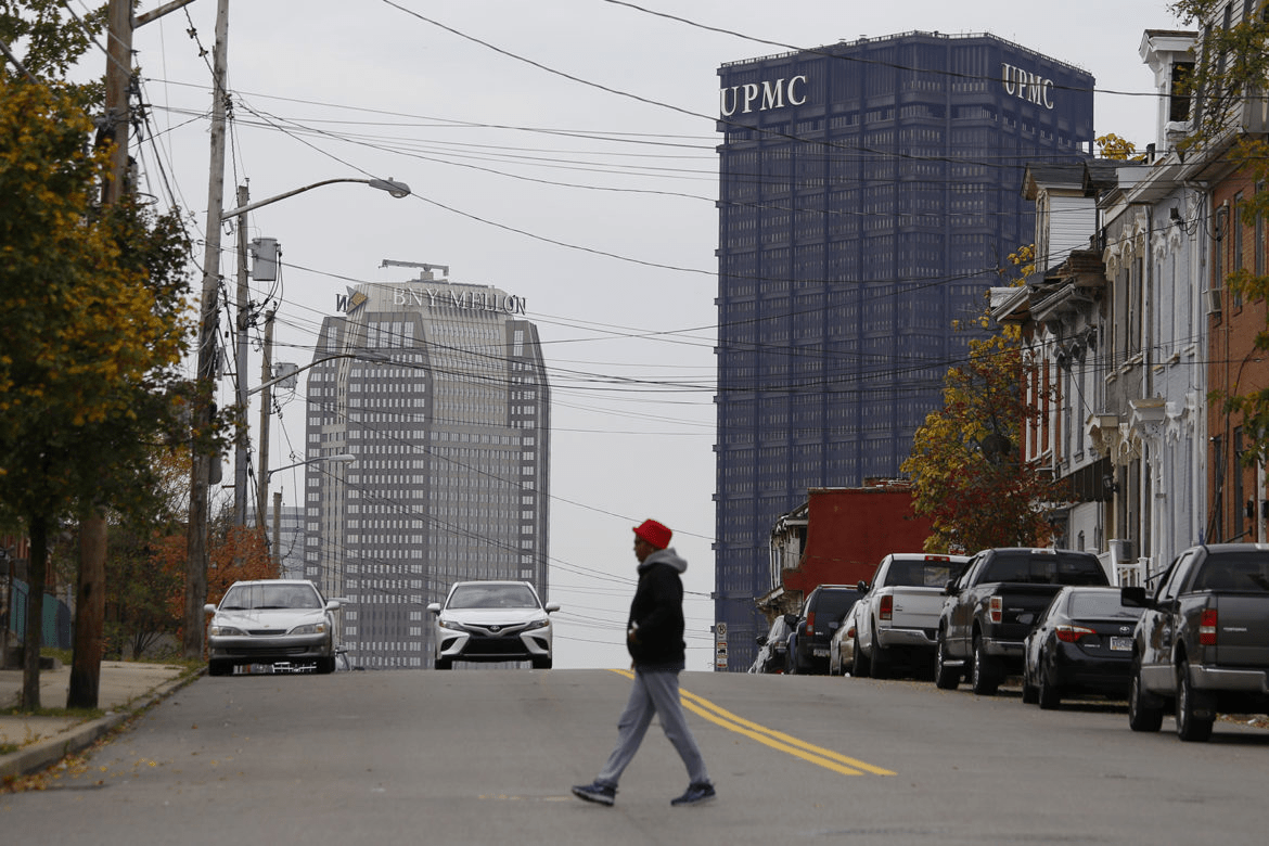 UPMC's logo atop the U.S. Steel Tower, Downtown, as seen from Webster Avenue in the Hill District. (Photo by Ryan Loew/PublicSource)